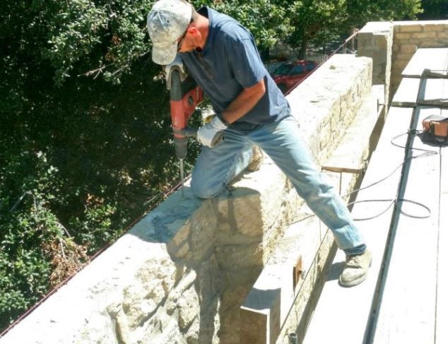 Driving rods into Francis House to stabilize the stone walls